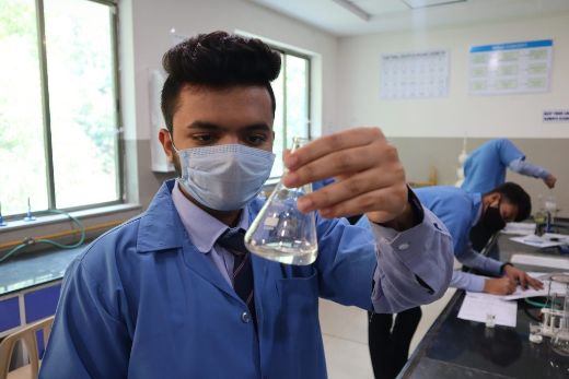 Students with Science Experiments